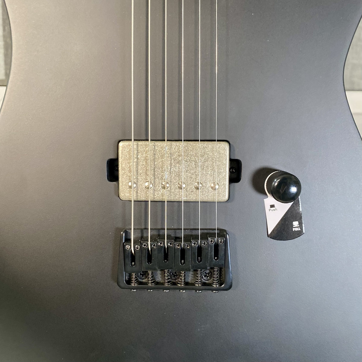 LTD M-201HT ESP LH-150B humbucker, fixed string-thru bridge and push-pull volume knob